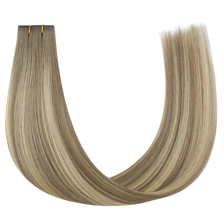 Butterfly wefts featuring brown and blonde balayage highlights for a chic, multi-dimensional look.