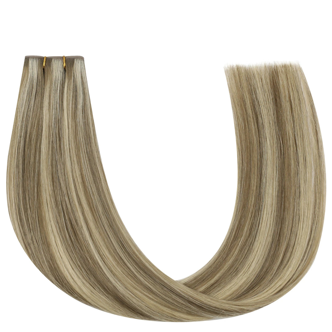 Easy-to-install butterfly weft extensions featuring honey blonde highlights for added shine.