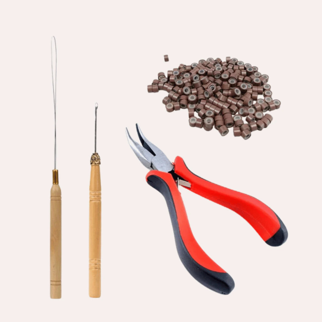 A variety of tools used to install and maintain hair extensions.