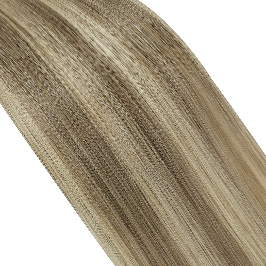 Luxe butterfly wefts offering a beautiful blend of blonde and brown highlights for a chic style.
