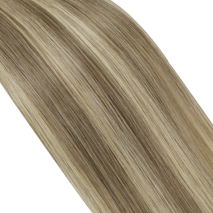 Luxe butterfly wefts offering a beautiful blend of blonde and brown highlights for a chic style.
