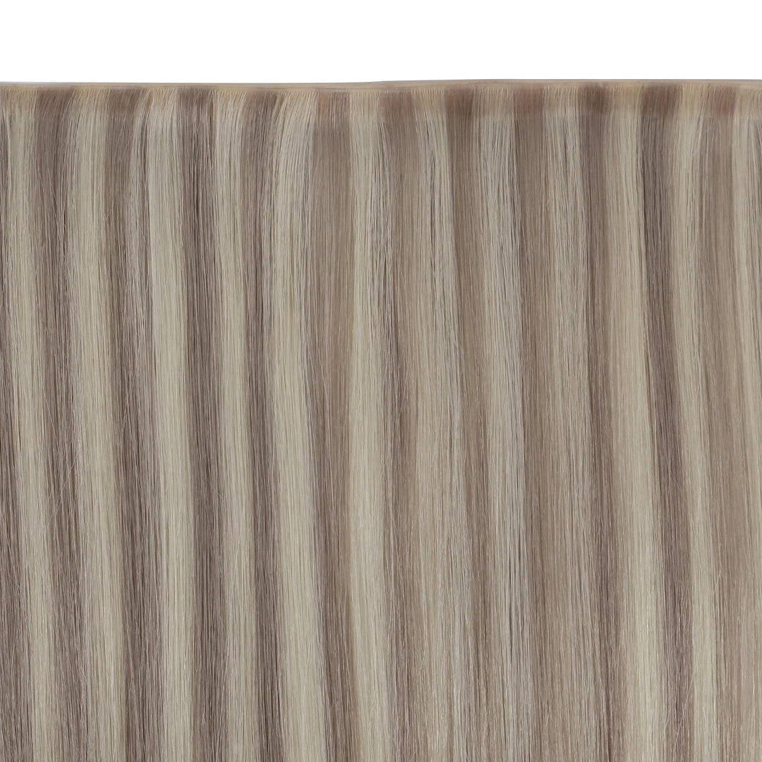 Silky butterfly weft extensions featuring soft highlights for added depth and dimension.