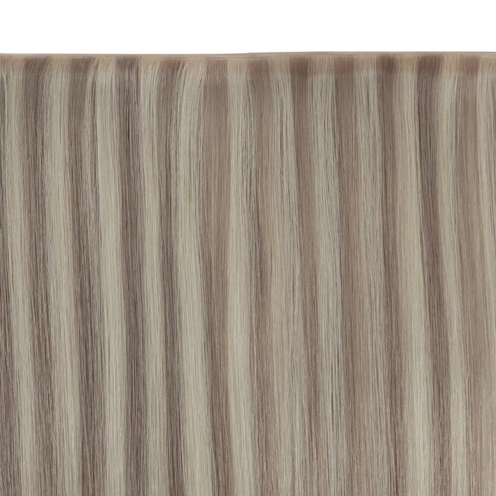 Silky butterfly weft extensions featuring soft highlights for added depth and dimension.