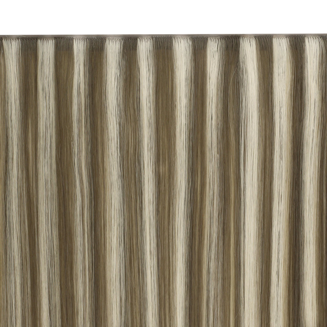 Smooth butterfly weft extensions with highlights, giving a natural and polished finish.