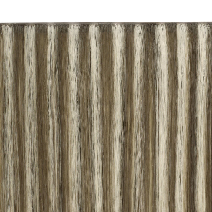 Smooth butterfly weft extensions with highlights, giving a natural and polished finish.