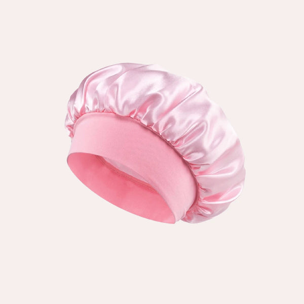 A satin-like sleep cap designed to protect hair from friction and damage during sleep.