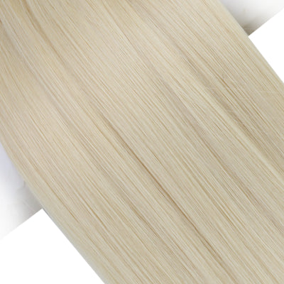 Blonde genius weft extensions in platinum shade